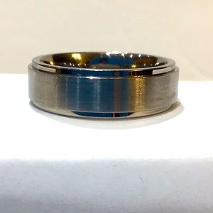 Titanium Revv ring, size 10. Hallmark inside.
